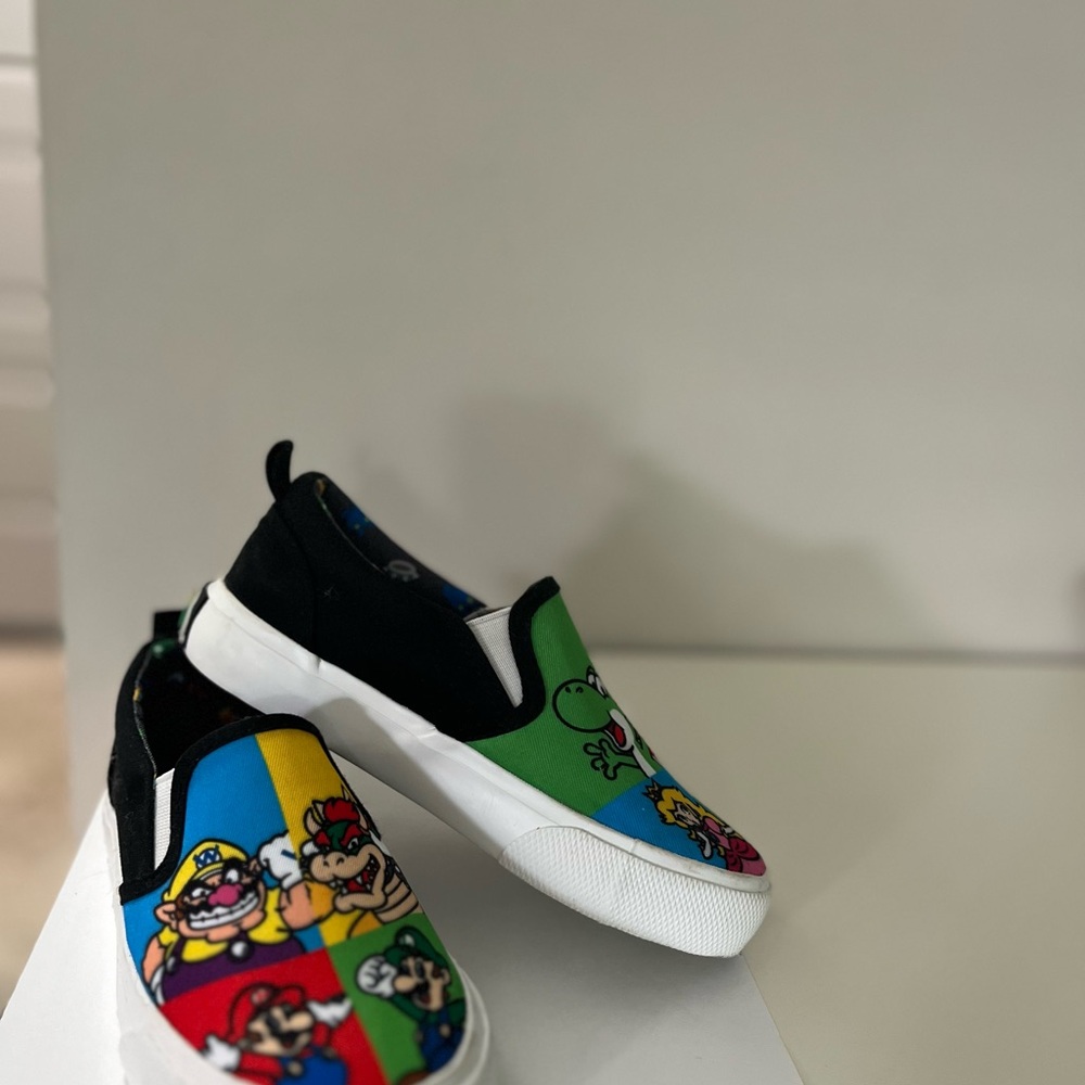 Nintendo Black and Green Sneakers Vibrant Slip-On Design